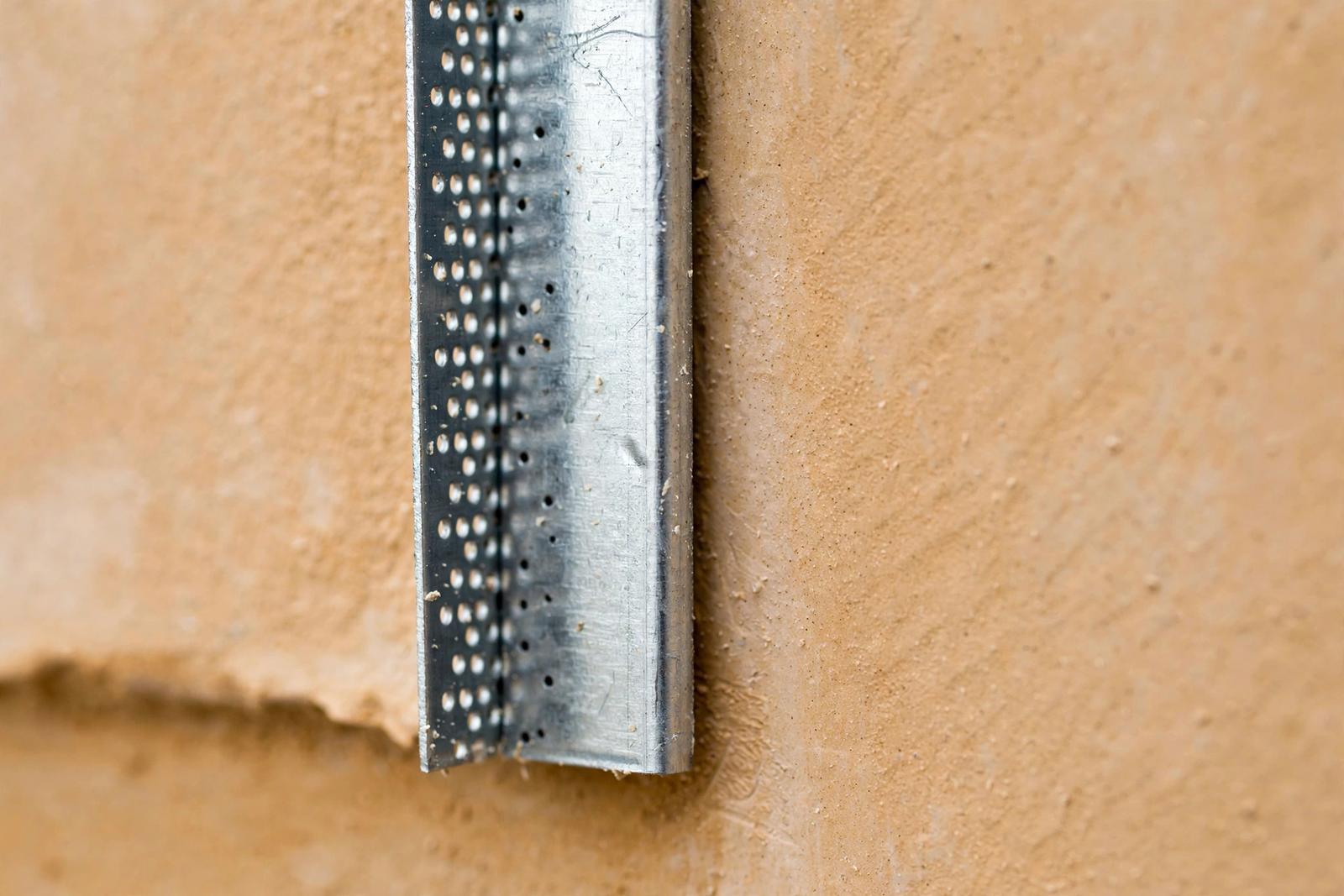 Metal corner bead set true on a finished wall corner